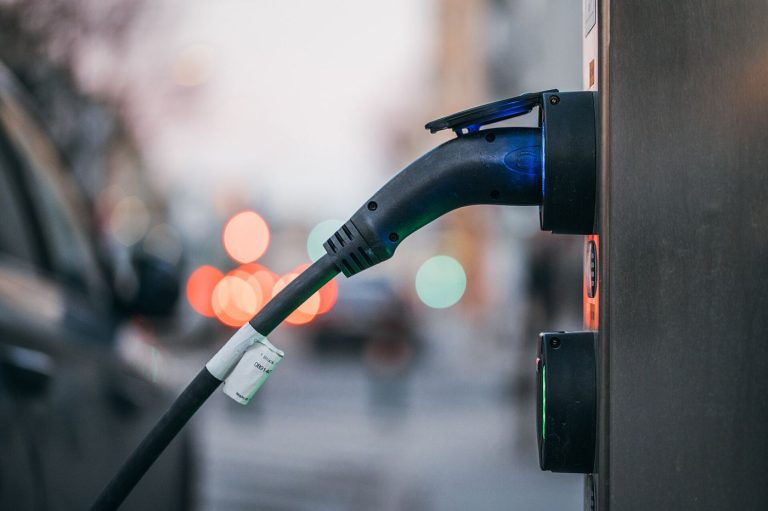 An electric car plugged into a charging station