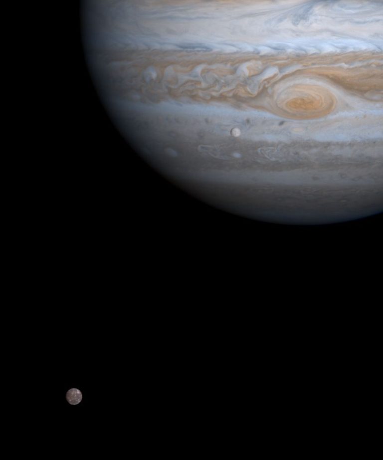 Europa’s Ice Shell Holds Clues to a Hidden Ocean Jupiter's icy moon Europa showing cracked white and rust-coloured ice lines against dark space.
