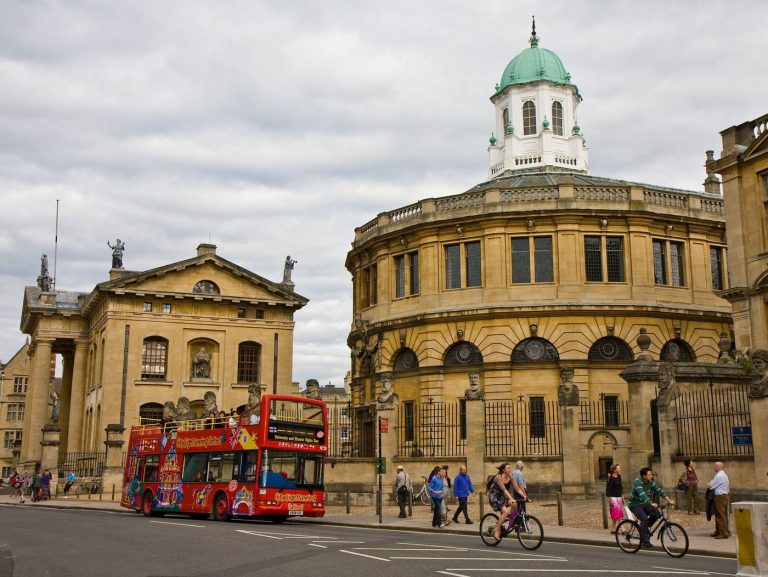 Bus Operators Publish Real-Time Crowding Data for Riders passengers boarding a city bus on a busy street
