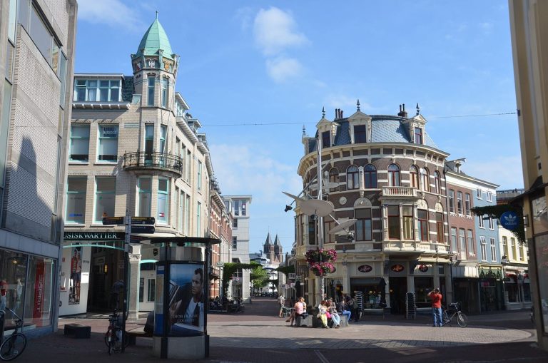 shoppers walking along a busy retail street