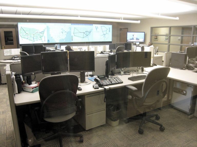 security operations centre team monitoring screens